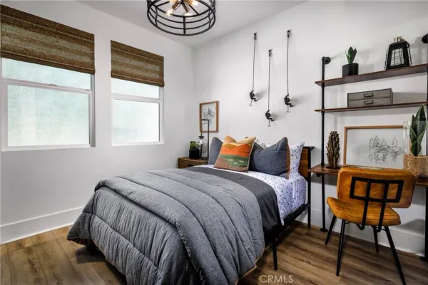 a bedroom with bed and a window