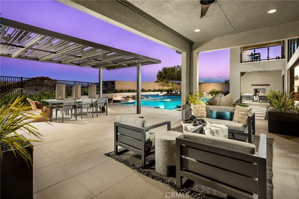 2291 Bliss Rnch Road Santa Rosa, CA 95401 - Photo 15 of 15 a view of a patio with dining table and chairs under an umbrella