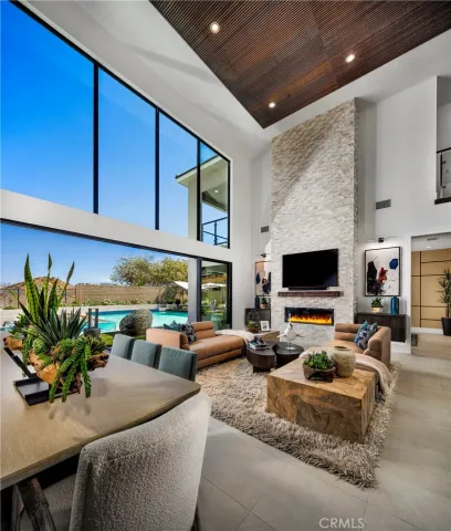 a living room with furniture fireplace and flat screen tv