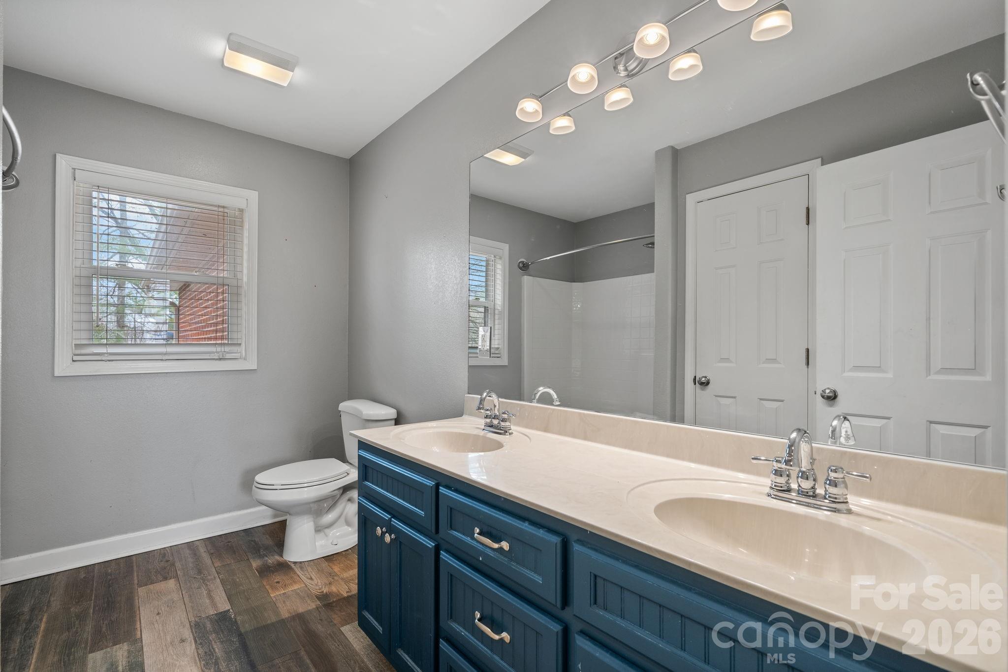 309 Sheldon Street Hudson, NC 28638 - Photo 18 of 35 a bathroom with a double vanity sink and a mirror