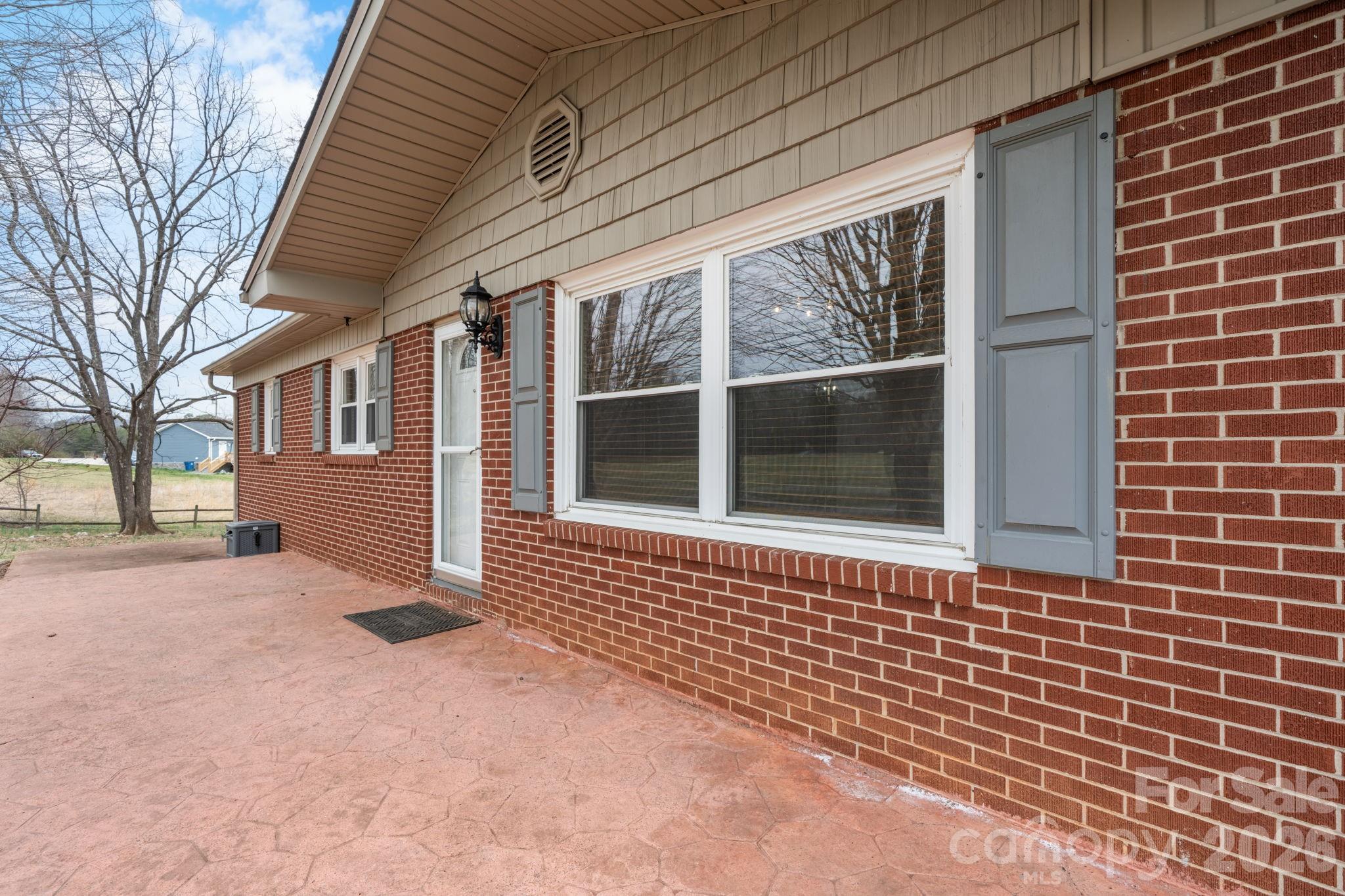 309 Sheldon Street Hudson, NC 28638 - Photo 2 of 35 a view of entrance to house with yard