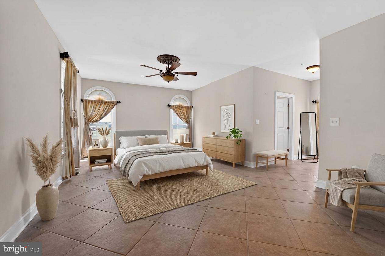 1165 Line Road Westminster, MD 21158 - Photo 22 of 75 a spacious bedroom with a bed and a chandelier