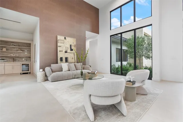 a room with a bed and a large window