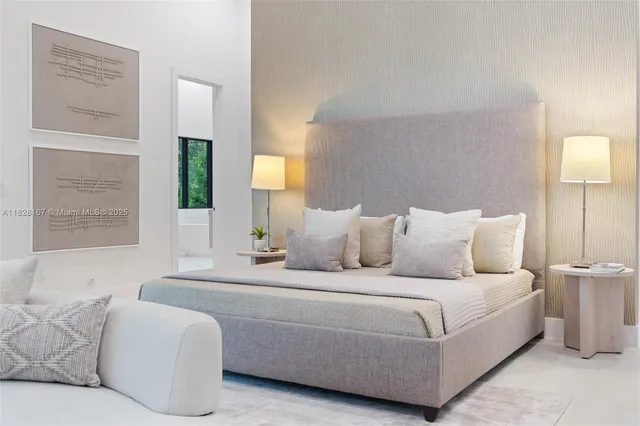 a bathroom with a large tub a double vanity sink a window and mirror