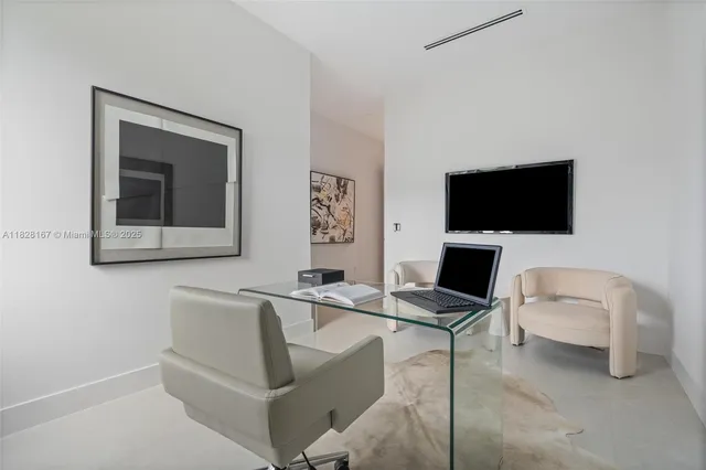 an aerial view of residential houses with outdoor space and street view