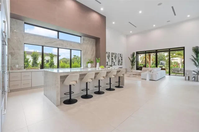 a view of hall with furniture and window