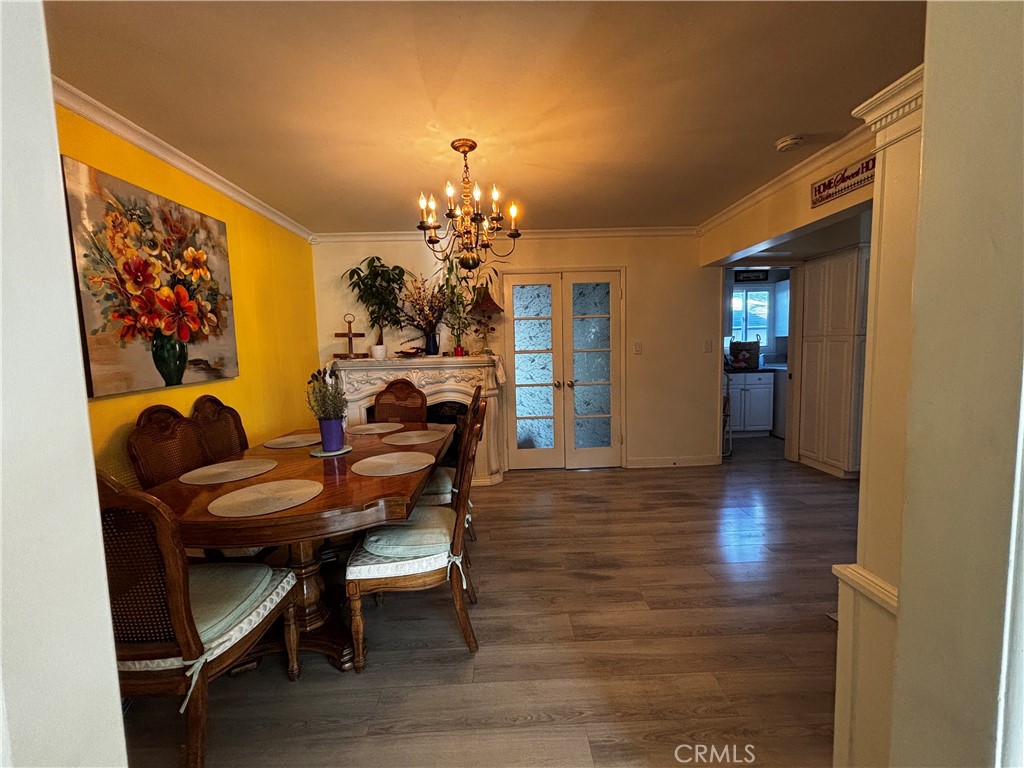 5604 Tower Road Riverside, CA 92506 - Photo 16 of 70 a view of a dining room with furniture and wooden floor