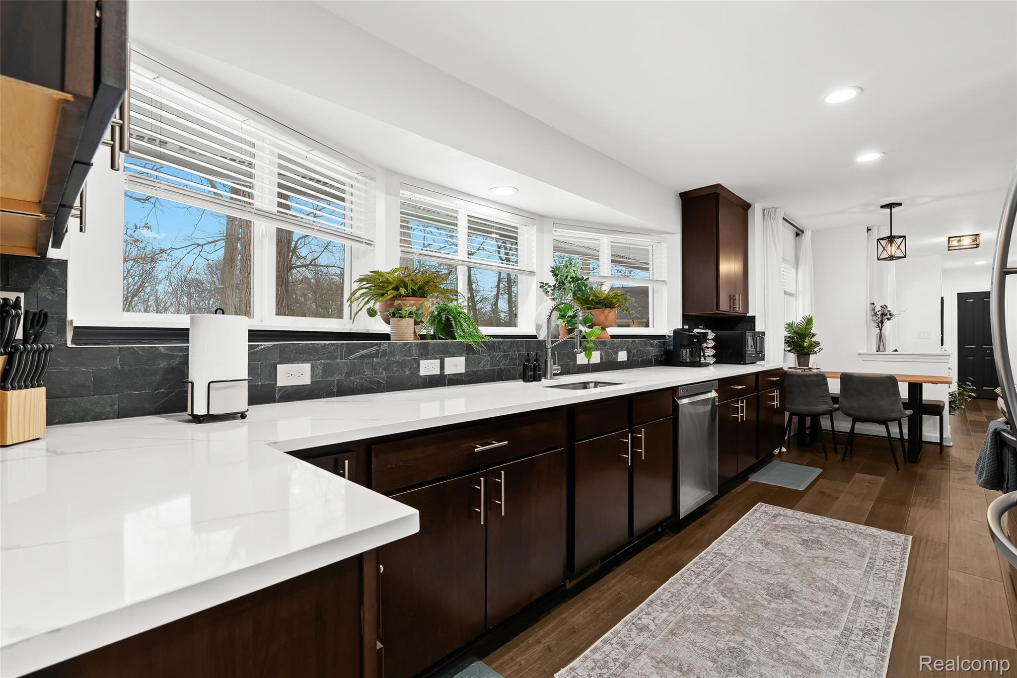 2566 Harrington Road Rochester, MI 48307 - Photo 11 of 64 Kitchen featuring backsplash, espresso hardwood cabinets, stainless steel appliances, and recessed lighting
