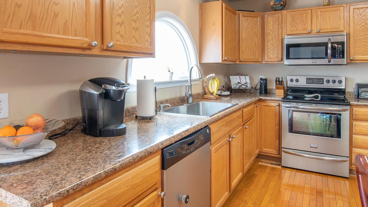 112 Aftons Meadow Road Vinton, VA 24179 - Photo 12 of 46 a kitchen with granite countertop a sink a stove and cabinets