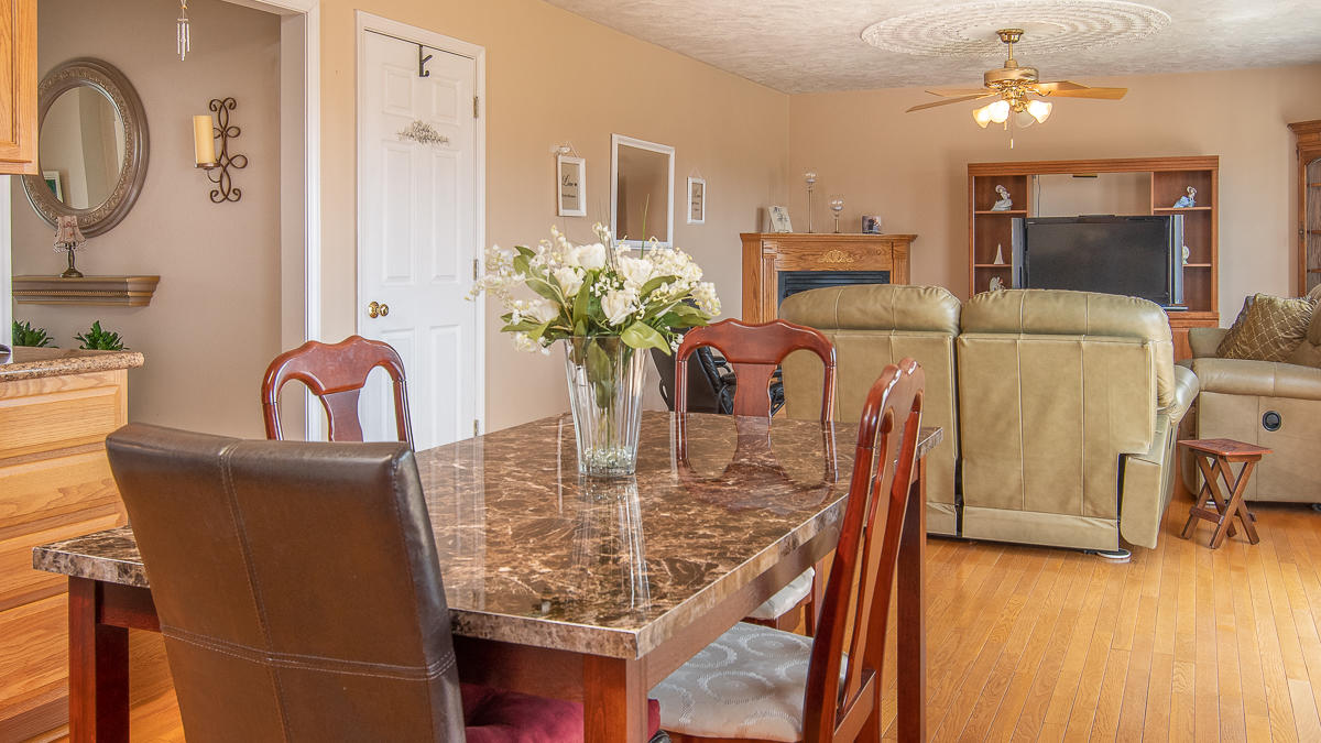 112 Aftons Meadow Road Vinton, VA 24179 - Photo 14 of 46 a view of a dining room with furniture and wooden floor