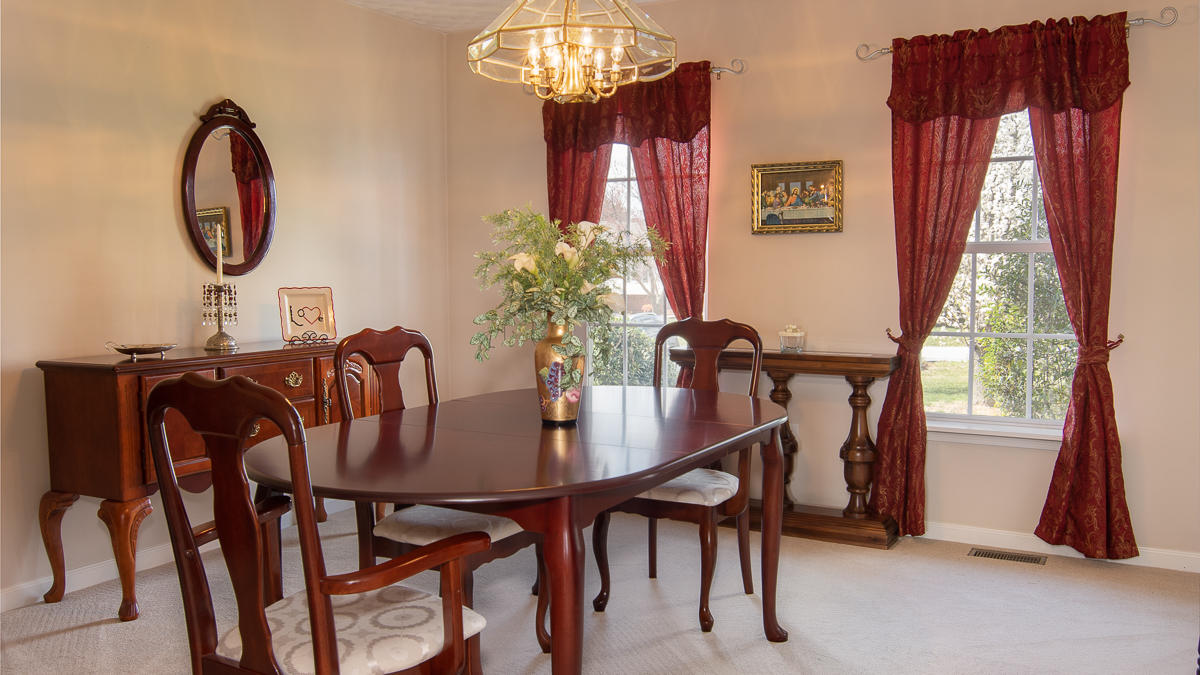 112 Aftons Meadow Road Vinton, VA 24179 - Photo 20 of 46 a view of a dining room with furniture and a chandelier