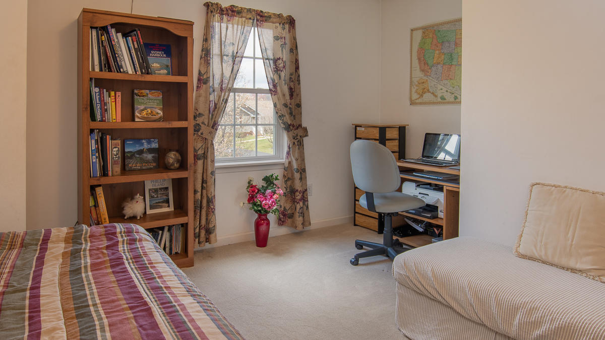 112 Aftons Meadow Road Vinton, VA 24179 - Photo 25 of 46 a view of a workspace with furniture and a book shelf