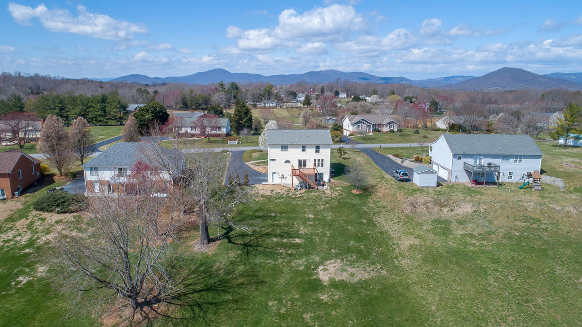 112 Aftons Meadow Road Vinton, VA 24179 - Photo 42 of 46 a view of a lake with a mountain in the background