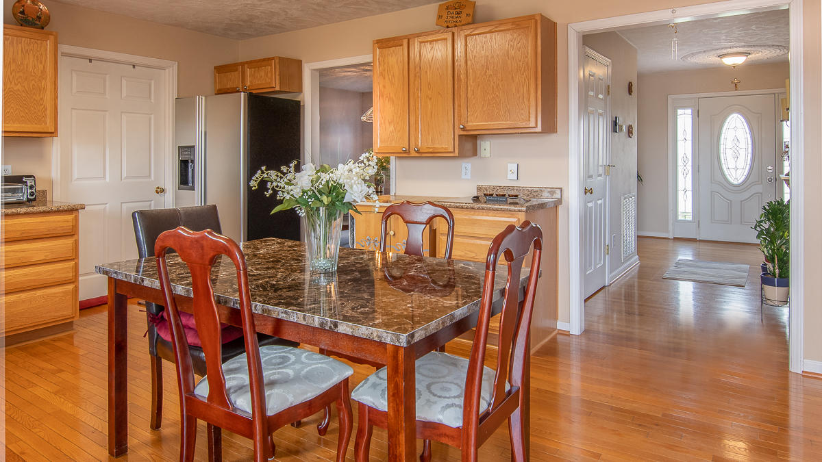 112 Aftons Meadow Road Vinton, VA 24179 - Photo 8 of 46 a dining room filled chandelier and wooden floor