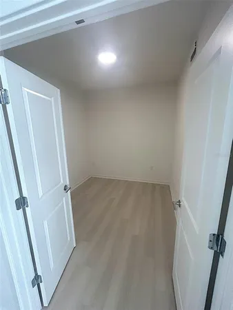 an empty room with a windows