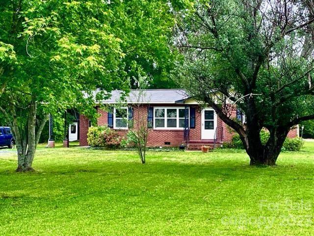 1608 Altura Road Fort Mill, SC 29708 - Photo 1 of 34 a front view of a house with a garden
