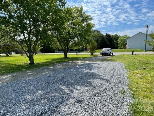 1608 Altura Road Fort Mill, SC 29708 - Photo 11 of 34 a view of a backyard with large trees