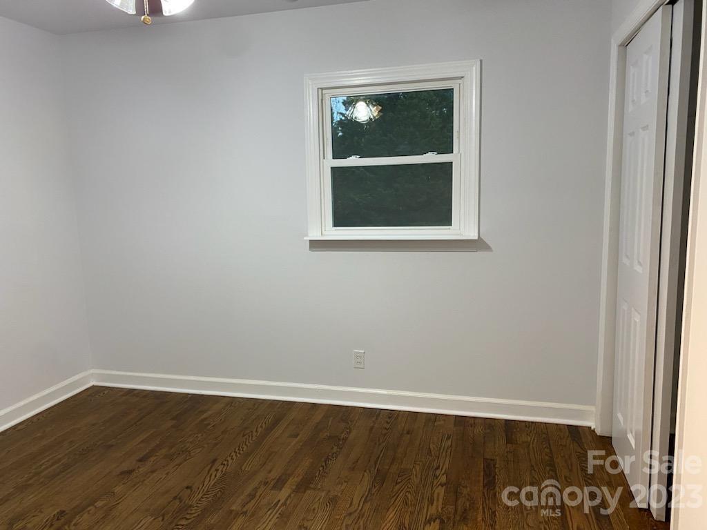 1608 Altura Road Fort Mill, SC 29708 - Photo 17 of 34 a view of an empty room with wooden floor and a window