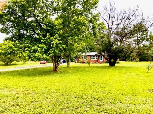1608 Altura Road Fort Mill, SC 29708 - Photo 2 of 34 a view of a swimming pool with an outdoor space and seating area