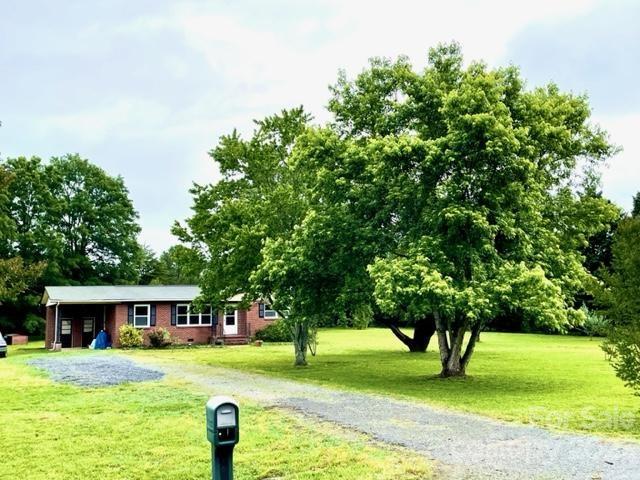 1608 Altura Road Fort Mill, SC 29708 - Photo 3 of 34 a front view of a house with a yard