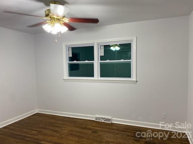 1608 Altura Road Fort Mill, SC 29708 - Photo 31 of 34 a view of an empty room with wooden floor and a window