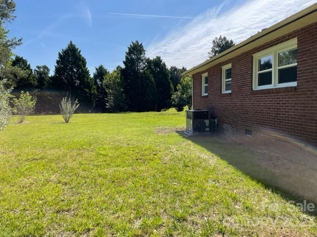 1608 Altura Road Fort Mill, SC 29708 - Photo 4 of 34 a backyard of a house with lots of green space and outdoor seating