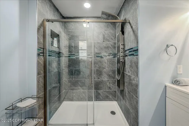 a bathroom with a shower and a toilet