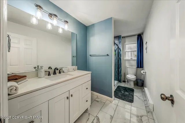 a bathroom with a sink double vanity and a mirror