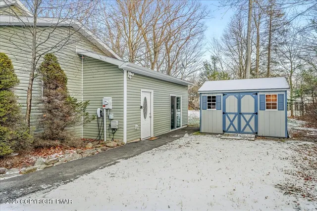 a view of a house with a yard and garage