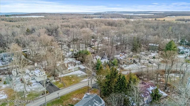a view of a yard with wooden floor and fence