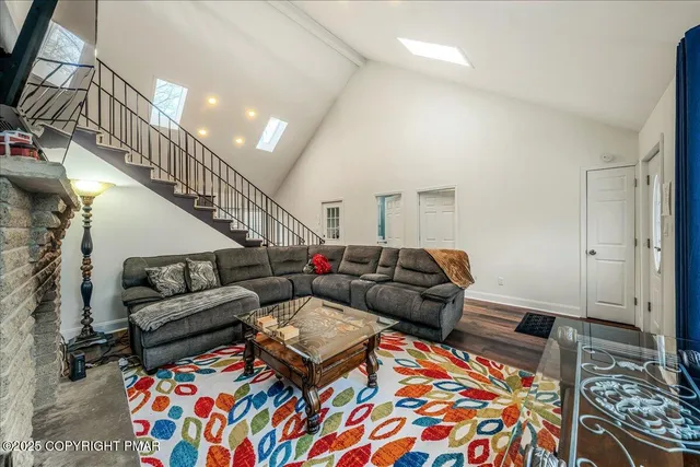 a living room with furniture and a rug