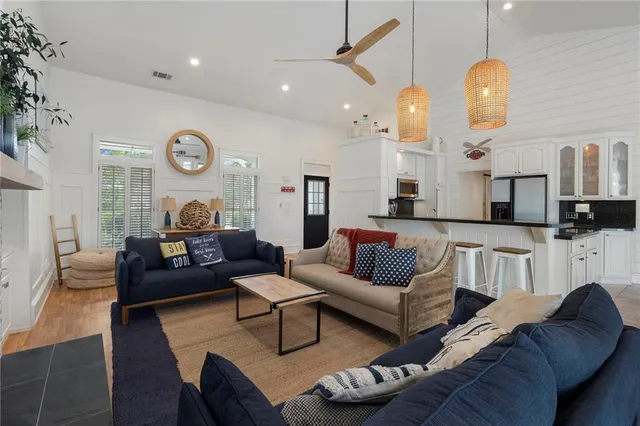 a kitchen with stainless steel appliances a stove a sink and a refrigerator