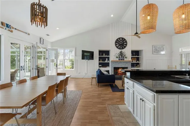 a kitchen with a sink stove top oven and cabinets