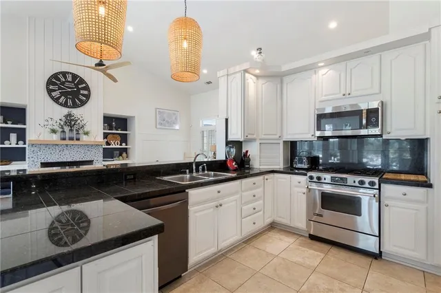 a view of a patio with a dining table and chairs