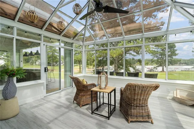 a bedroom with a large bed and a flat tv screen