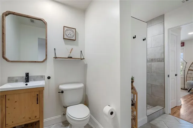 a bathroom with a sink a vanity and a bathtub