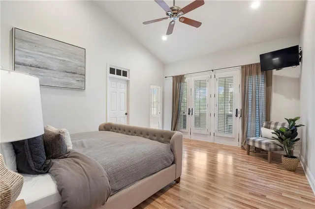 a bathroom with a sink a toilet a mirror and shower