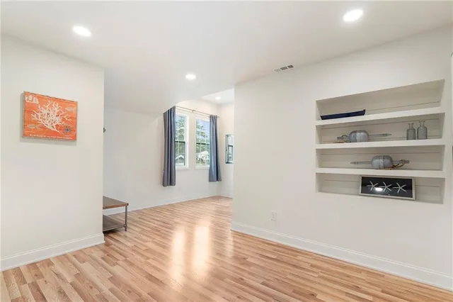 a living room with couch and a flat screen tv