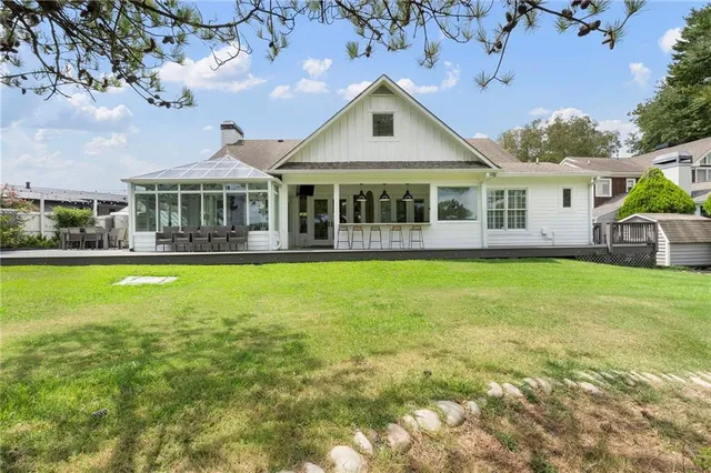 a view of a balcony with furniture and wooden floor