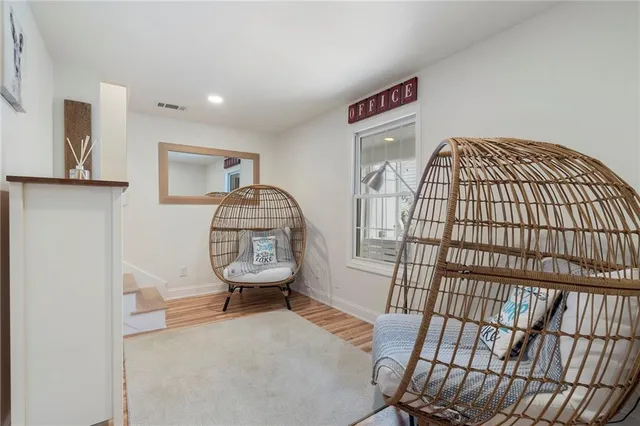 a spacious bedroom with a bed and flat screen tv