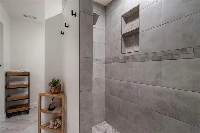 a bathroom with a sink a toilet and a shower