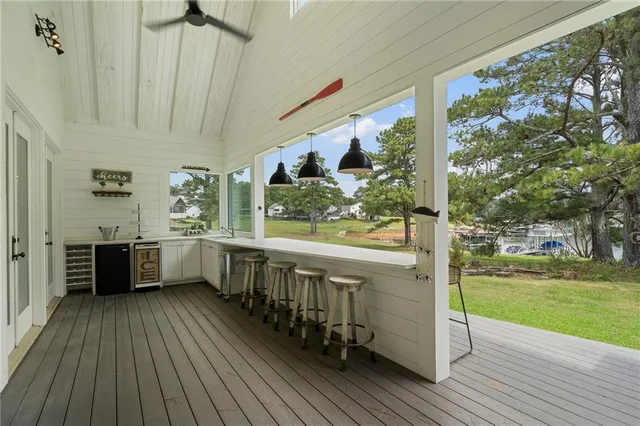 a view of a house with a porch and furniture