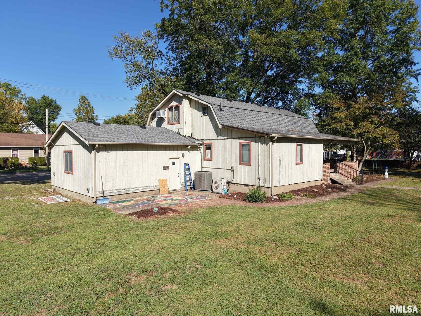 601 1st Street Benton, IL 62812 - Photo 14 of 53 a view of a house with a yard and sitting area