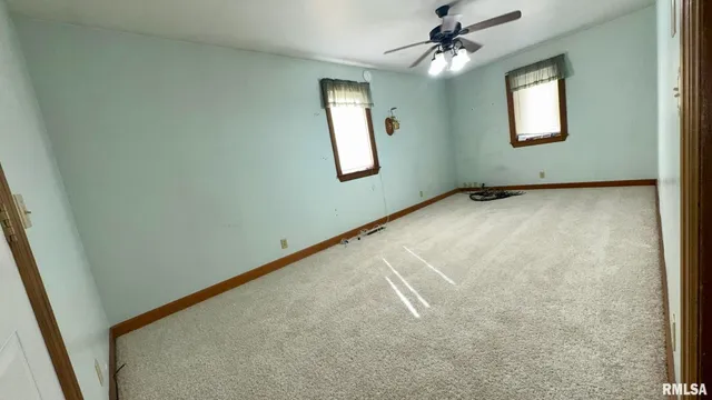 a kitchen with a refrigerator and a stove