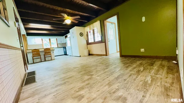 a dining room with a sink and a refrigerator