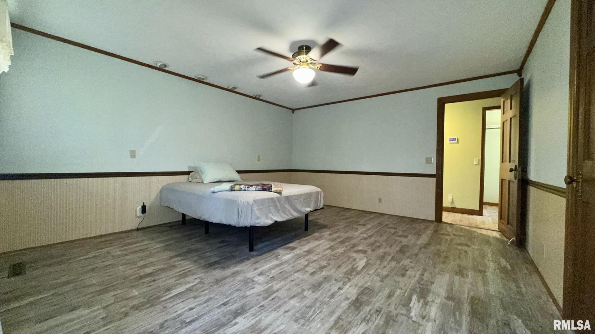 601 1st Street Benton, IL 62812 - Photo 41 of 53 a view of a room with wooden floor and chandelier