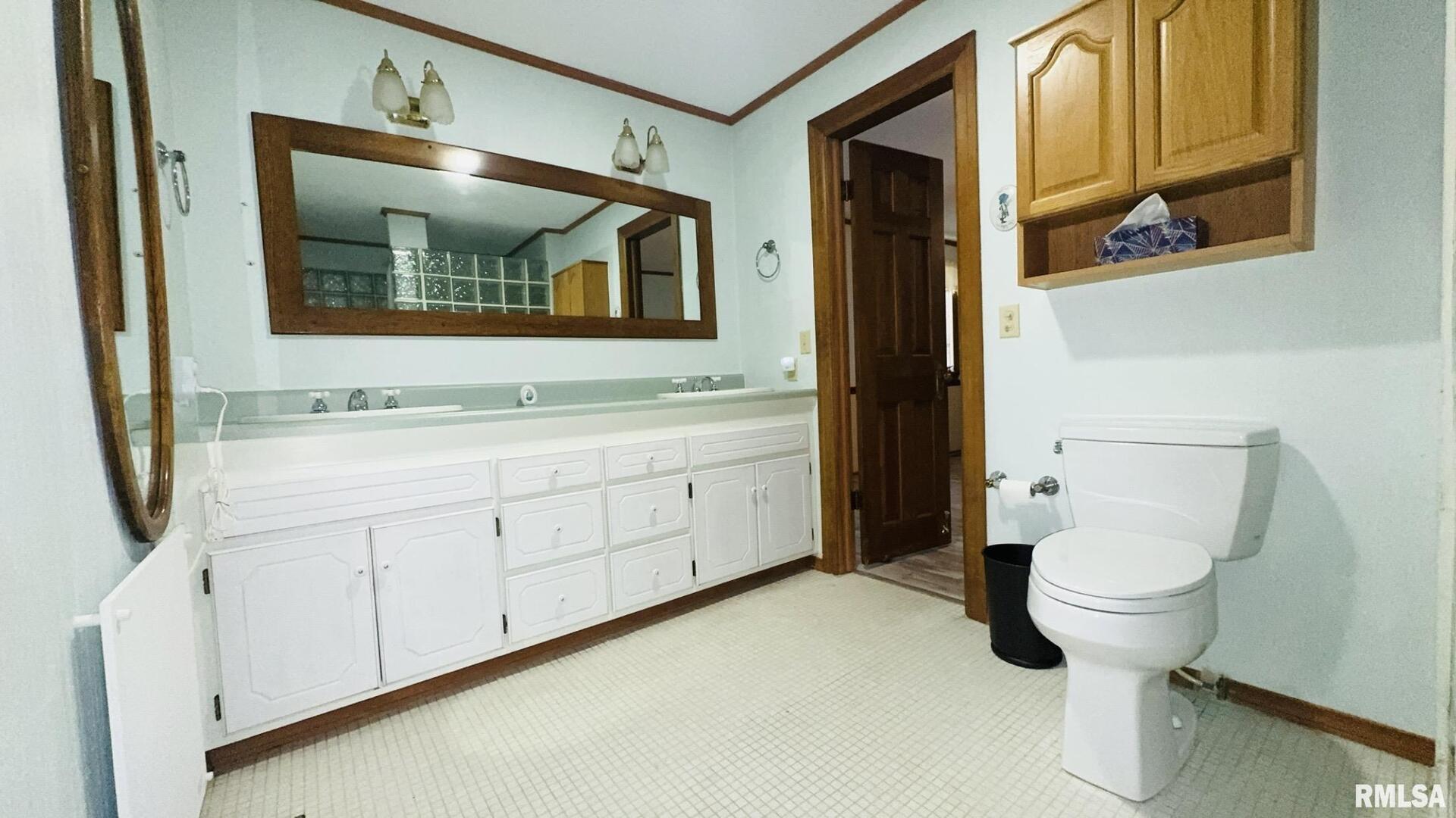 601 1st Street Benton, IL 62812 - Photo 44 of 53 a bathroom with a toilet sink and mirror