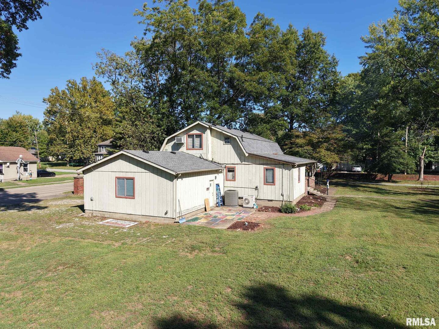 601 1st Street Benton, IL 62812 - Photo 10 of 53 a house that has a tree in front of it