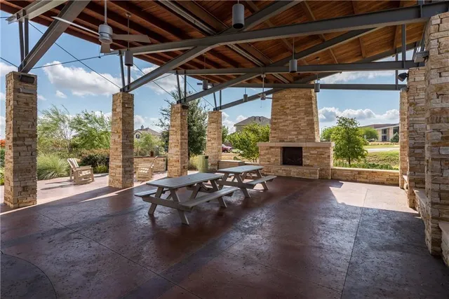 a view of a porch with furniture and a backyard
