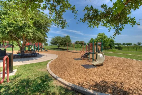 a view of a park with swings